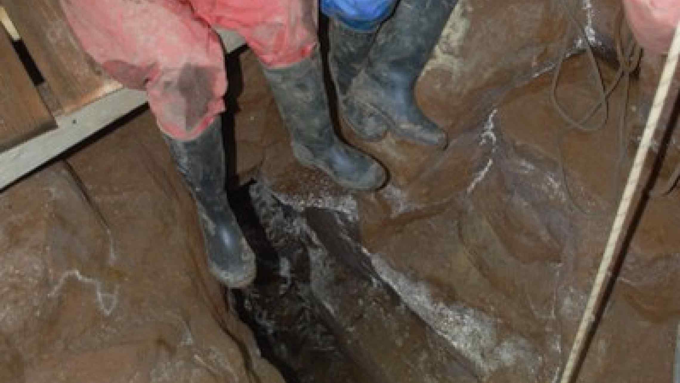 Mine explorers abseiling deep in a Cornish tin mine near St. Ives