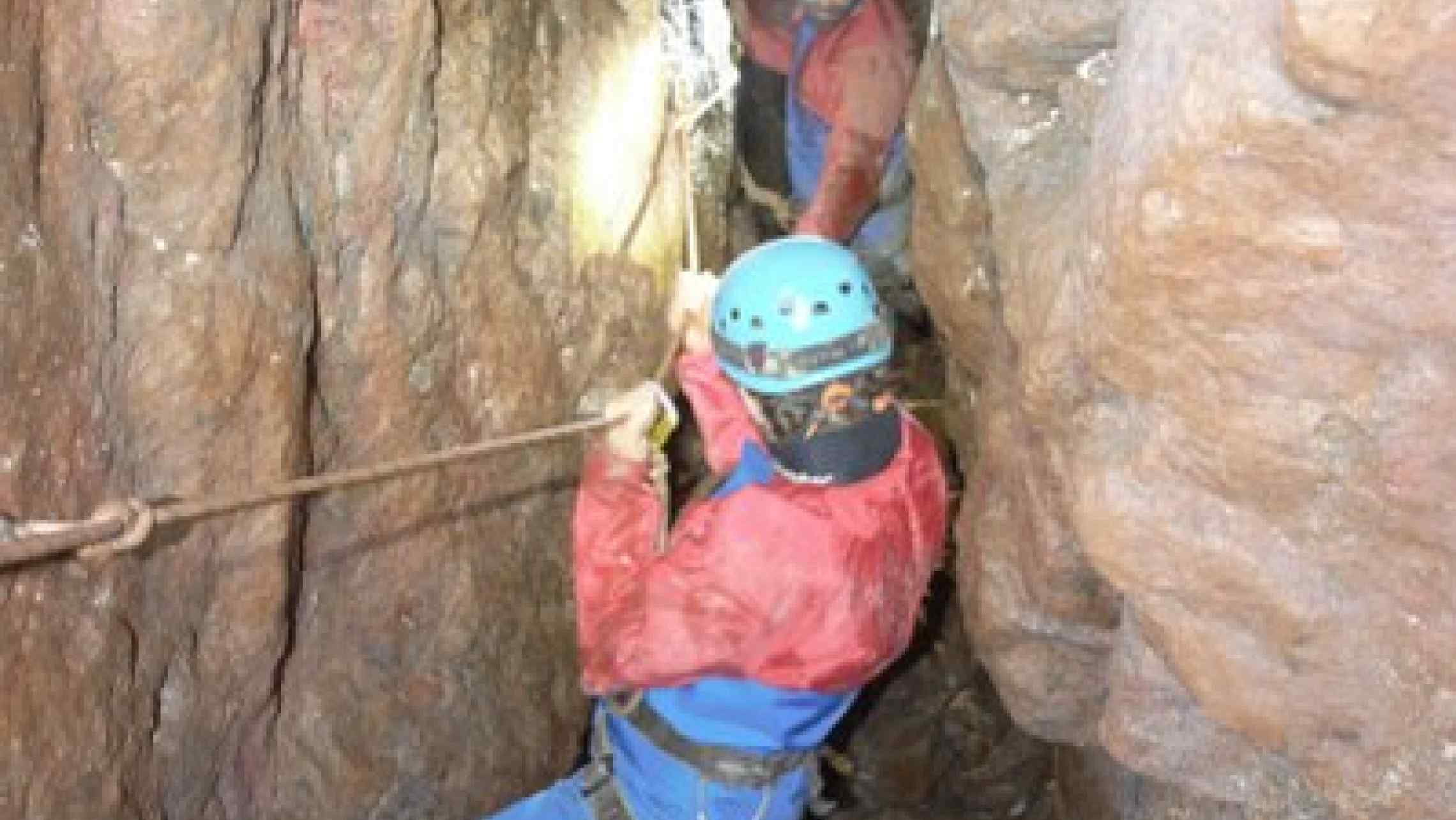 Traversing across a tin mine shaft deep underground in Cornwall.